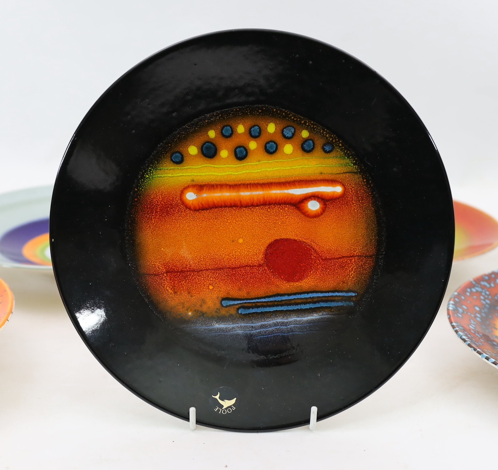 Alan Clarke for Poole Pottery. A set of nine ‘Alignment of the Planets’ chargers and one duplicate, c.2000, 26cm diameter